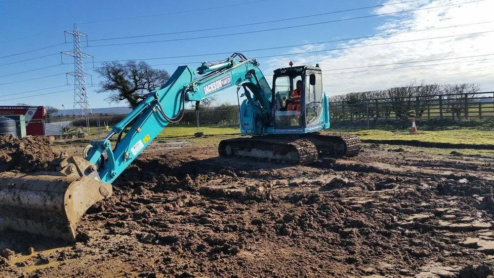Excavator on a practical training ground