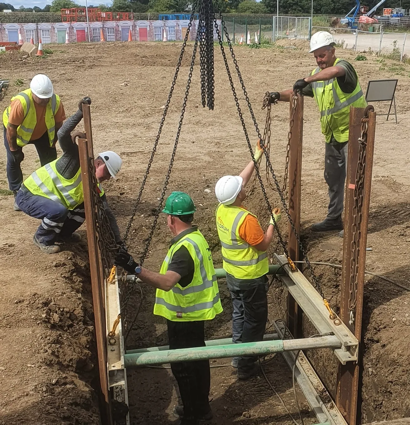 Candidates installing steel trench shoring supports